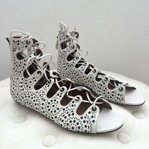 Alaia perforated sandals in white. Size 37